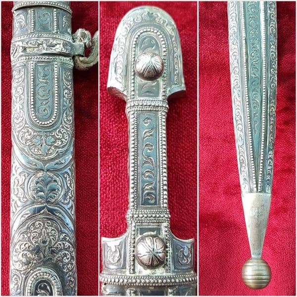 A fine Russian Kindjal the hilt and scabbard covered in nielloed silver mounts. Good condition. Ref 9825.